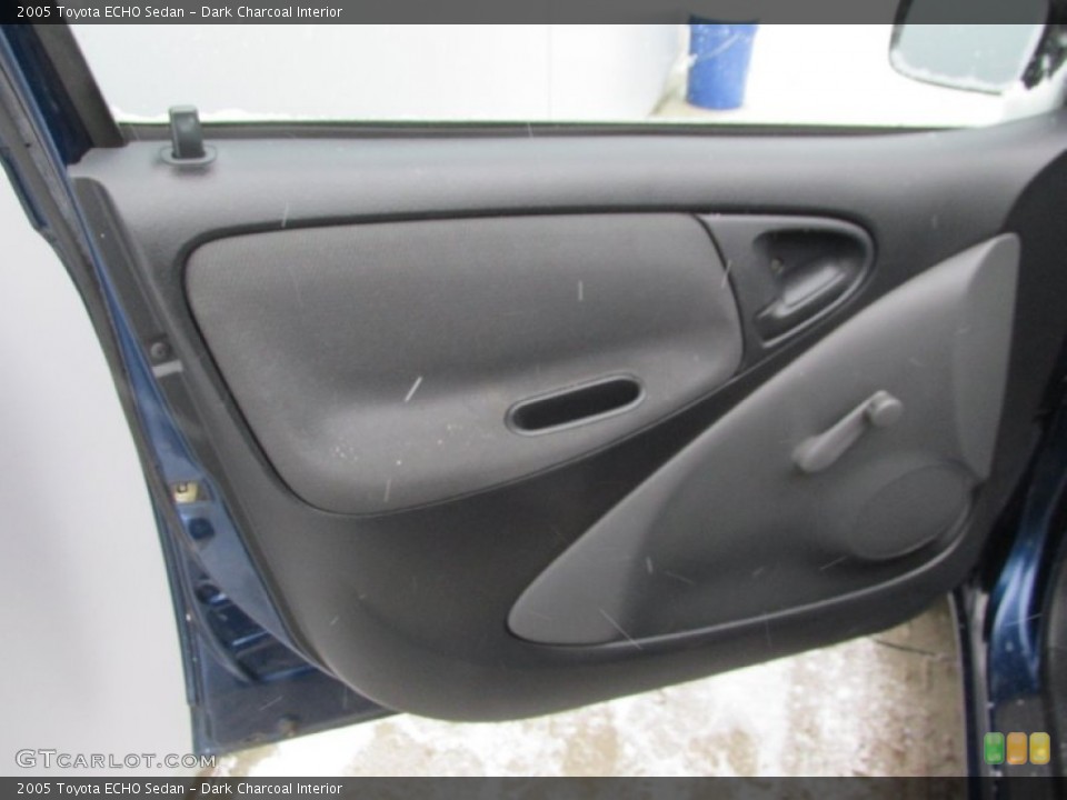 Dark Charcoal Interior Door Panel for the 2005 Toyota ECHO Sedan #89990753