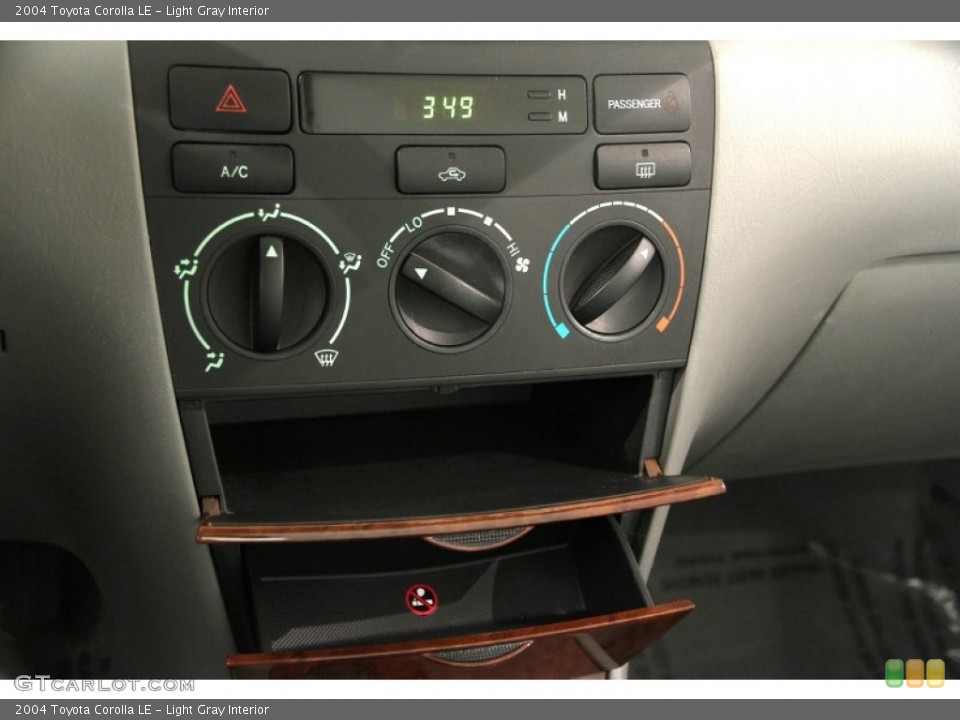 Light Gray Interior Controls for the 2004 Toyota Corolla LE #90349413