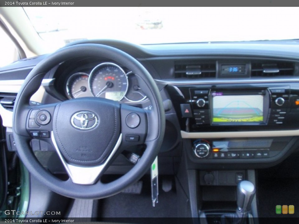 Ivory Interior Dashboard for the 2014 Toyota Corolla LE #90358702
