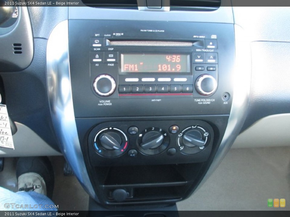 Beige Interior Controls for the 2011 Suzuki SX4 Sedan LE #90397606
