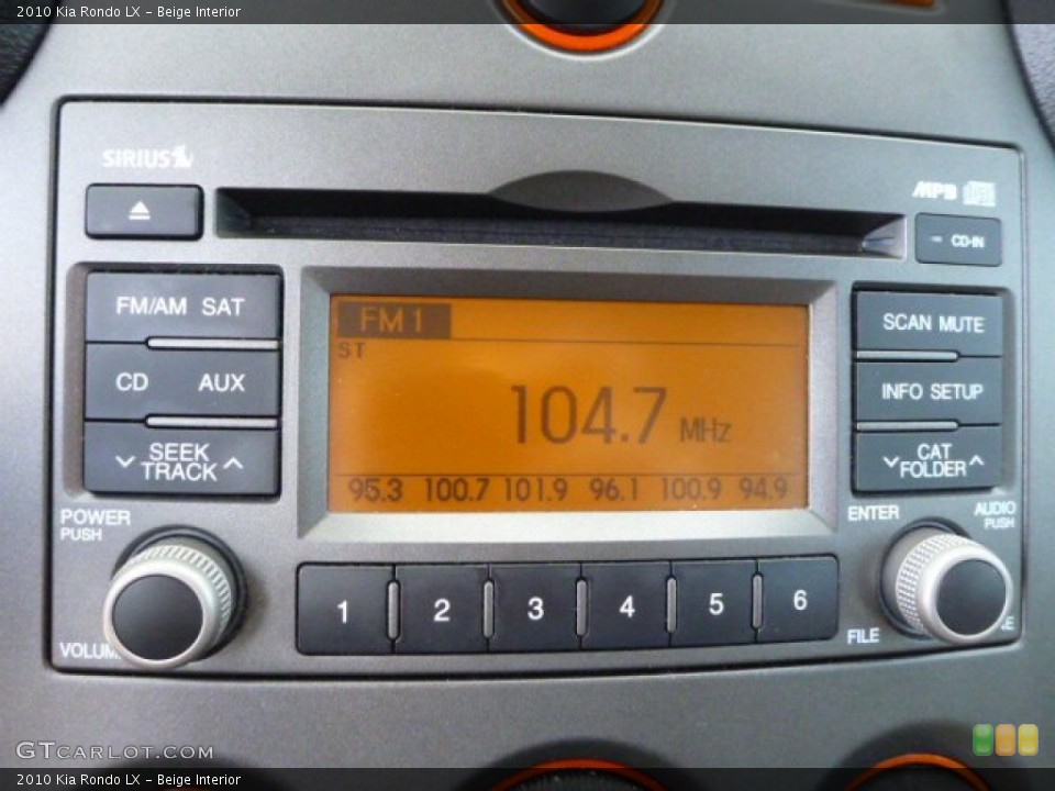 Beige Interior Audio System for the 2010 Kia Rondo LX #92353533
