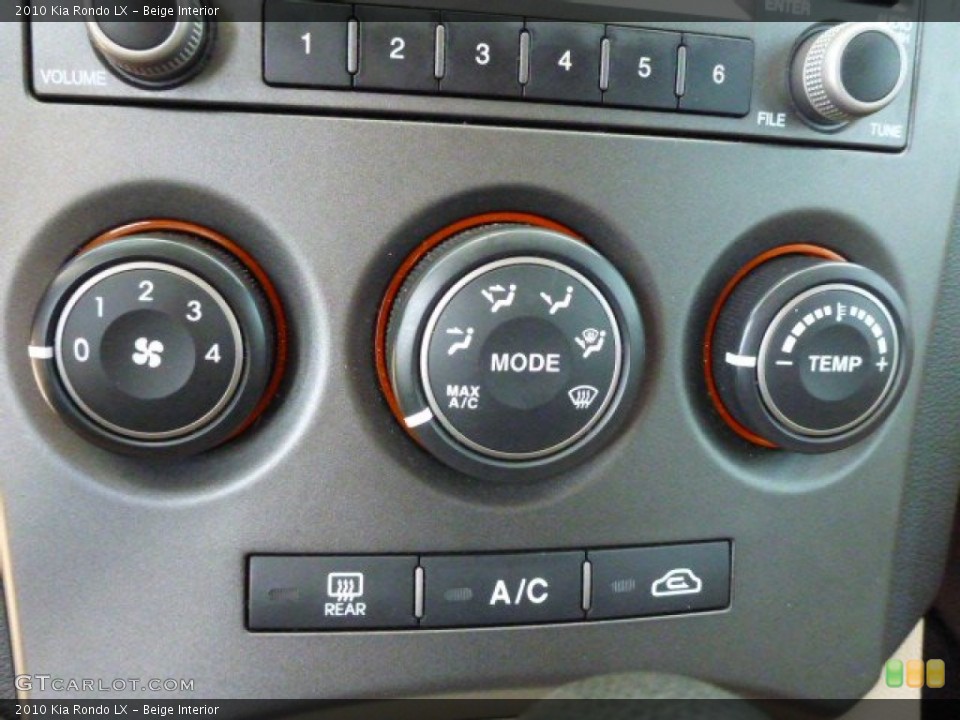 Beige Interior Controls for the 2010 Kia Rondo LX #92353557