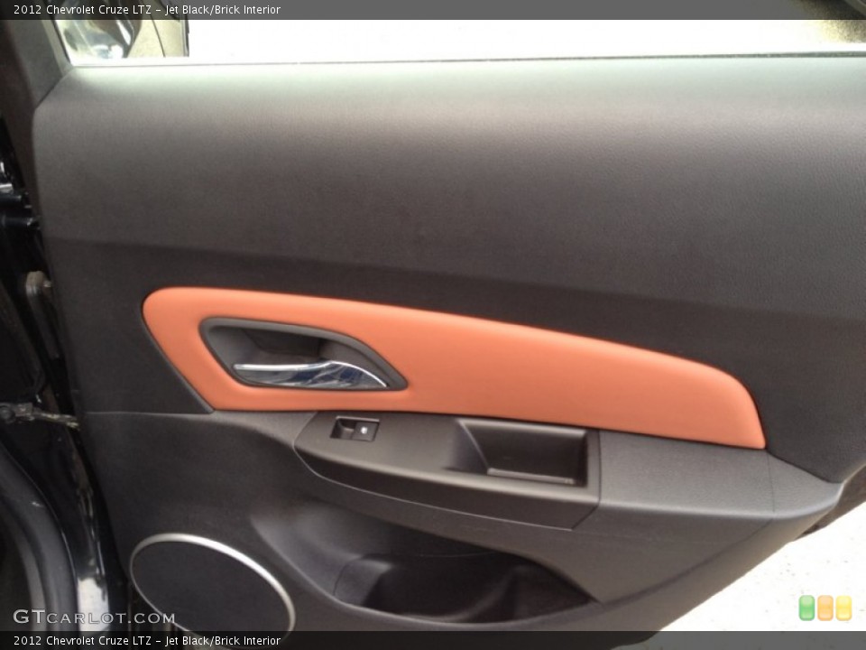 Jet Black/Brick Interior Door Panel for the 2012 Chevrolet Cruze LTZ #92881022