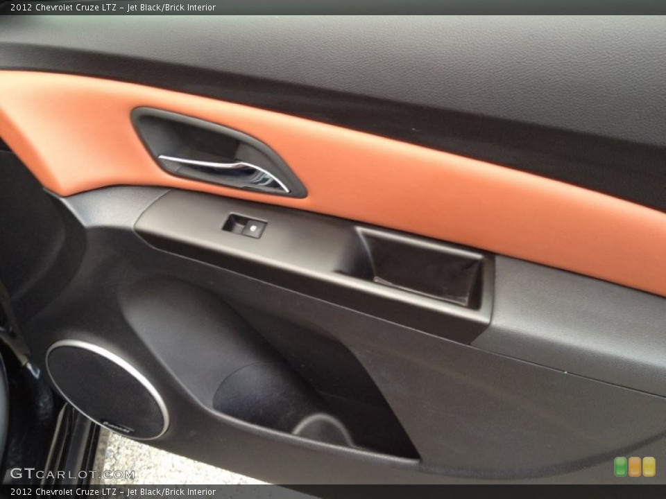 Jet Black/Brick Interior Door Panel for the 2012 Chevrolet Cruze LTZ #92881103