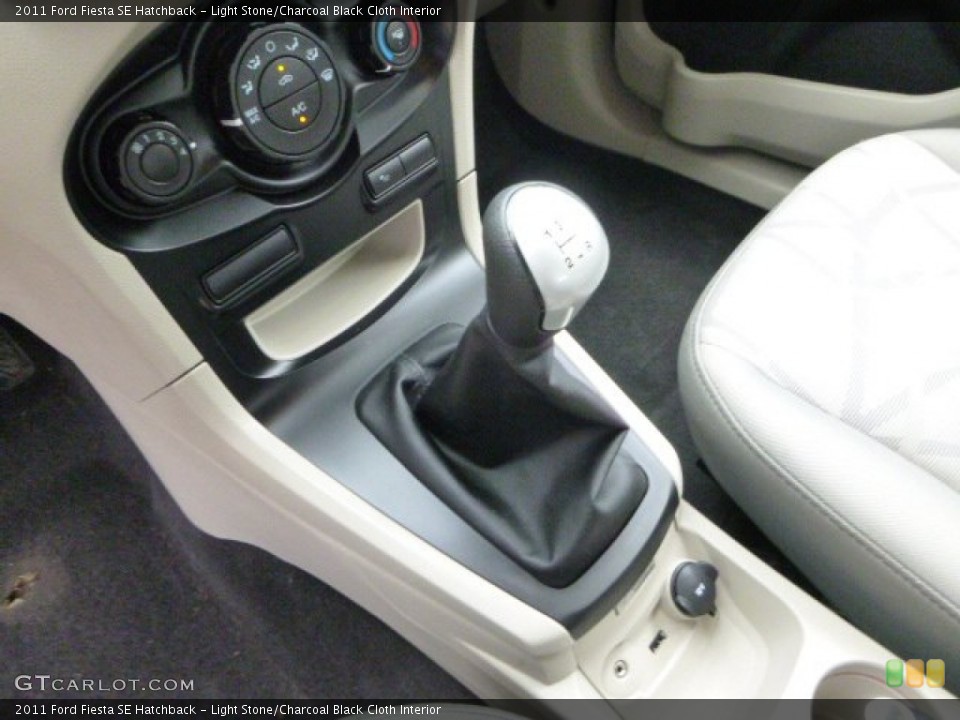 Light Stone/Charcoal Black Cloth Interior Transmission for the 2011 Ford Fiesta SE Hatchback #94055490