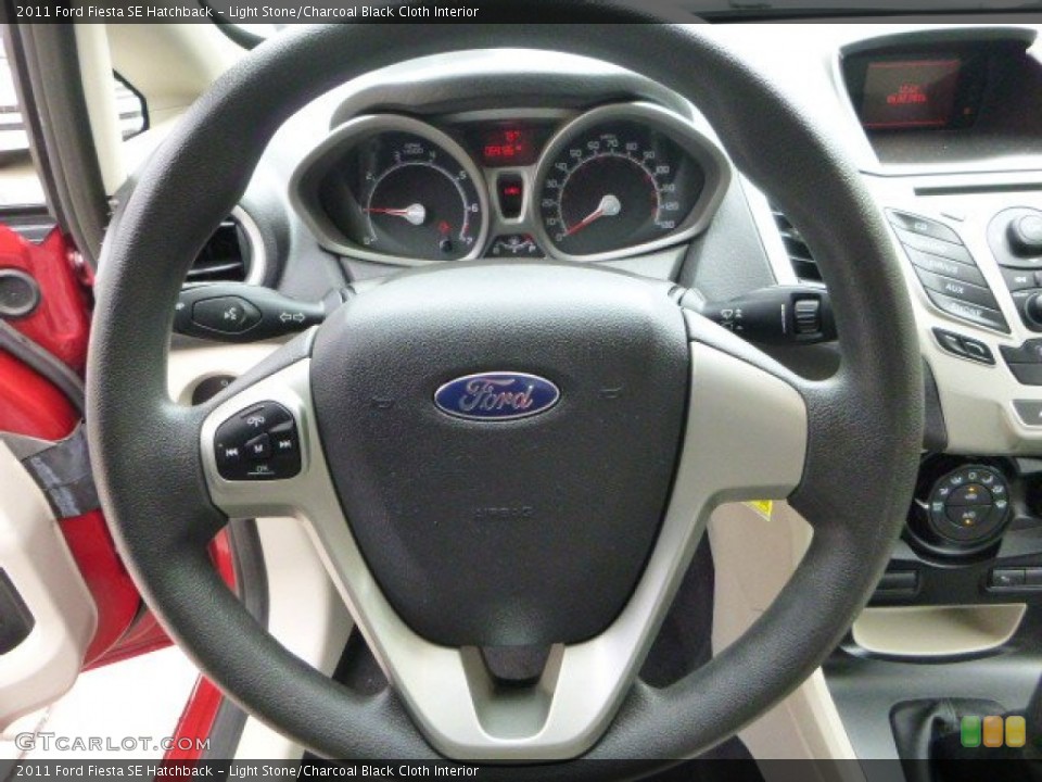 Light Stone/Charcoal Black Cloth Interior Steering Wheel for the 2011 Ford Fiesta SE Hatchback #94055514