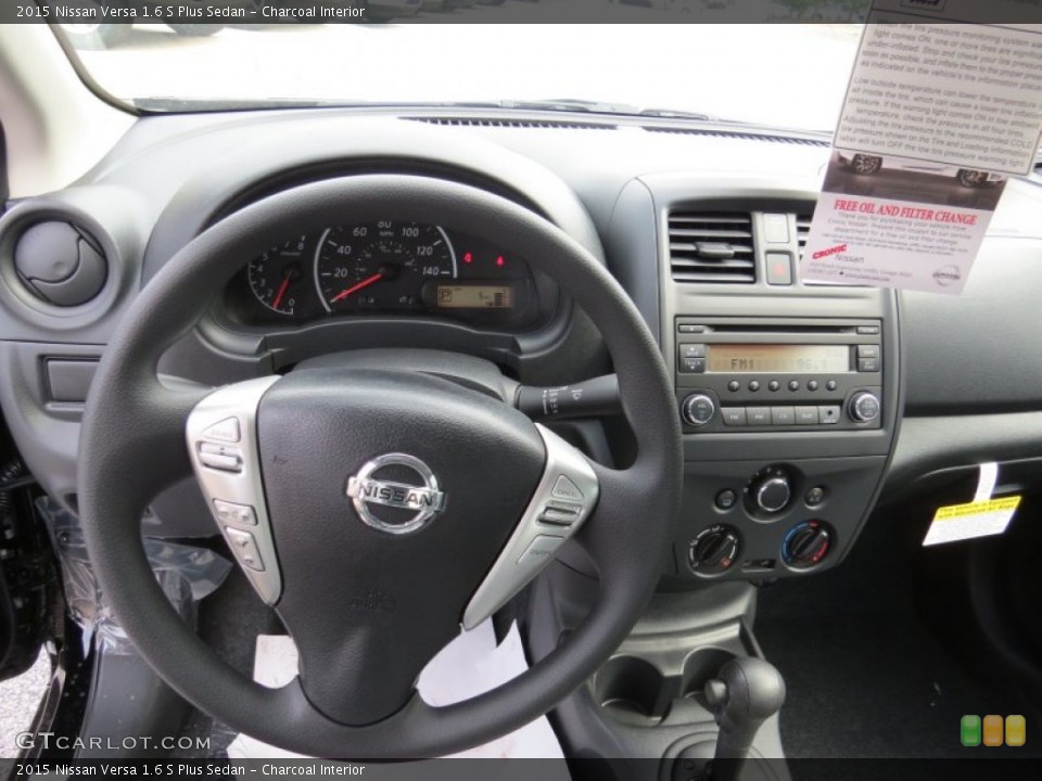 Charcoal Interior Dashboard for the 2015 Nissan Versa 1.6 S Plus Sedan #94191673