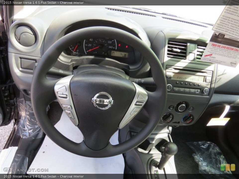 Charcoal Interior Steering Wheel for the 2015 Nissan Versa 1.6 S Plus Sedan #94340389