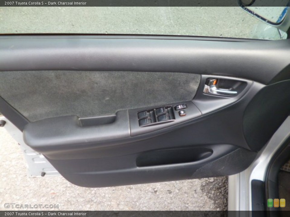Dark Charcoal Interior Door Panel for the 2007 Toyota Corolla S #94779912