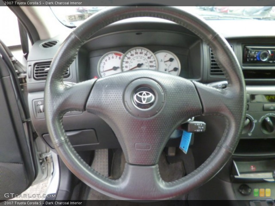 Dark Charcoal Interior Steering Wheel for the 2007 Toyota Corolla S #94779954