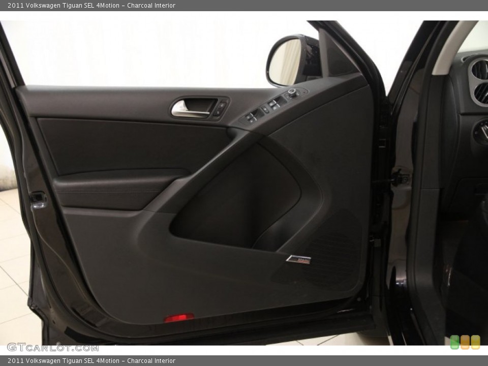 Charcoal Interior Door Panel for the 2011 Volkswagen Tiguan SEL 4Motion #95825782