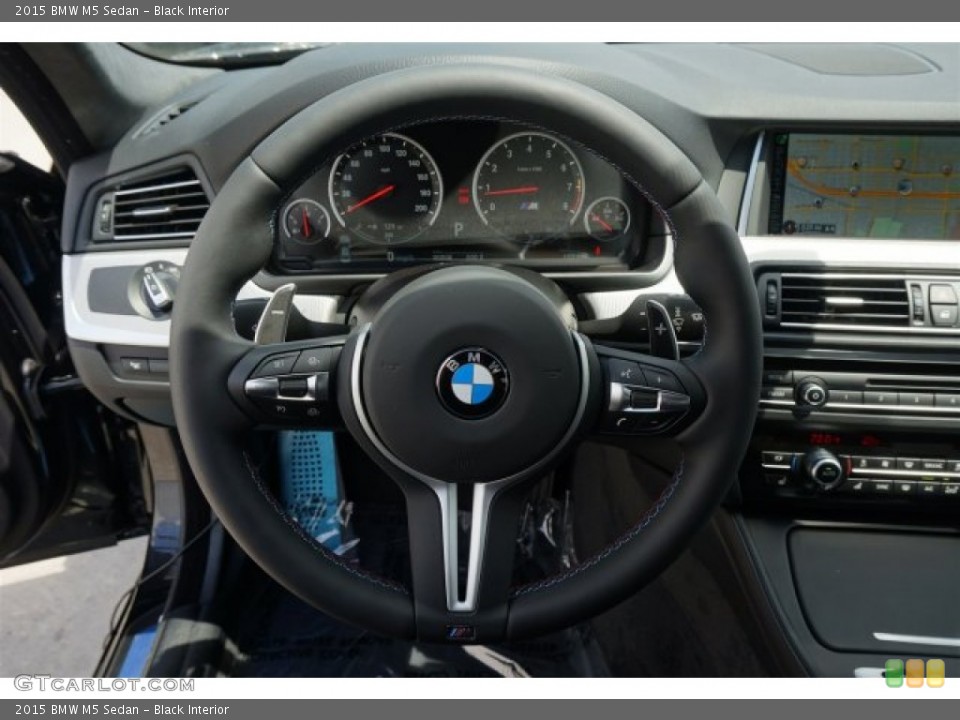 Black Interior Steering Wheel for the 2015 BMW M5 Sedan #96580076