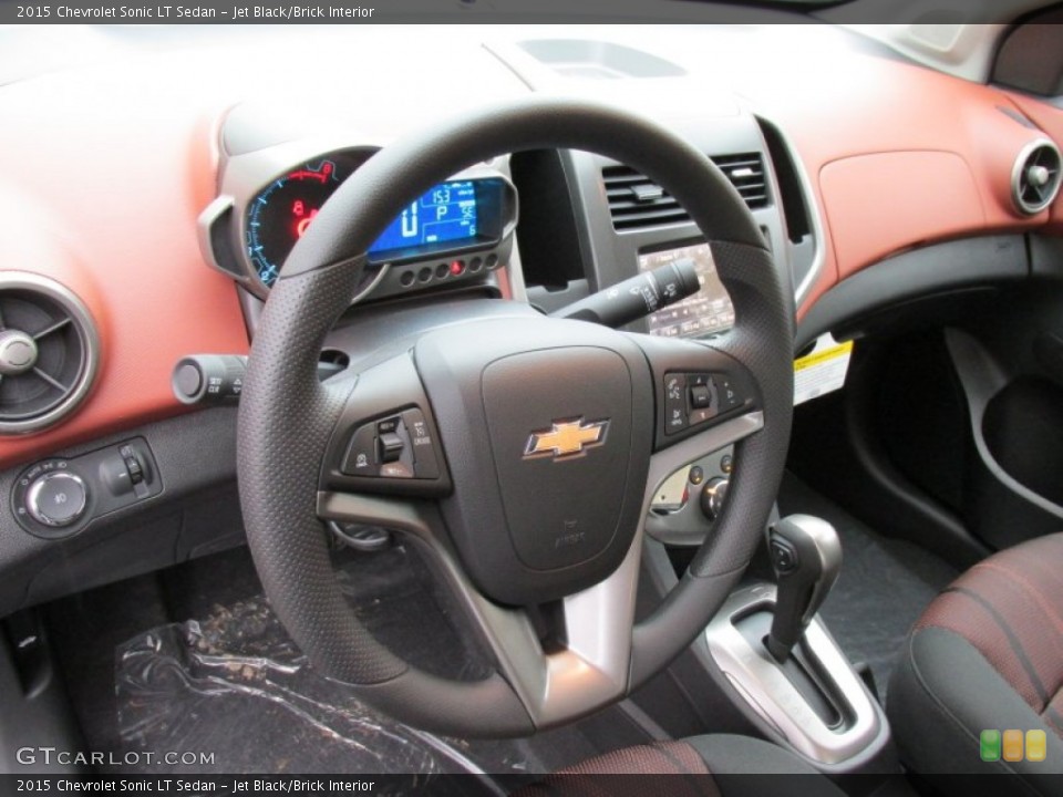 Jet Black/Brick Interior Steering Wheel for the 2015 Chevrolet Sonic LT Sedan #98402419