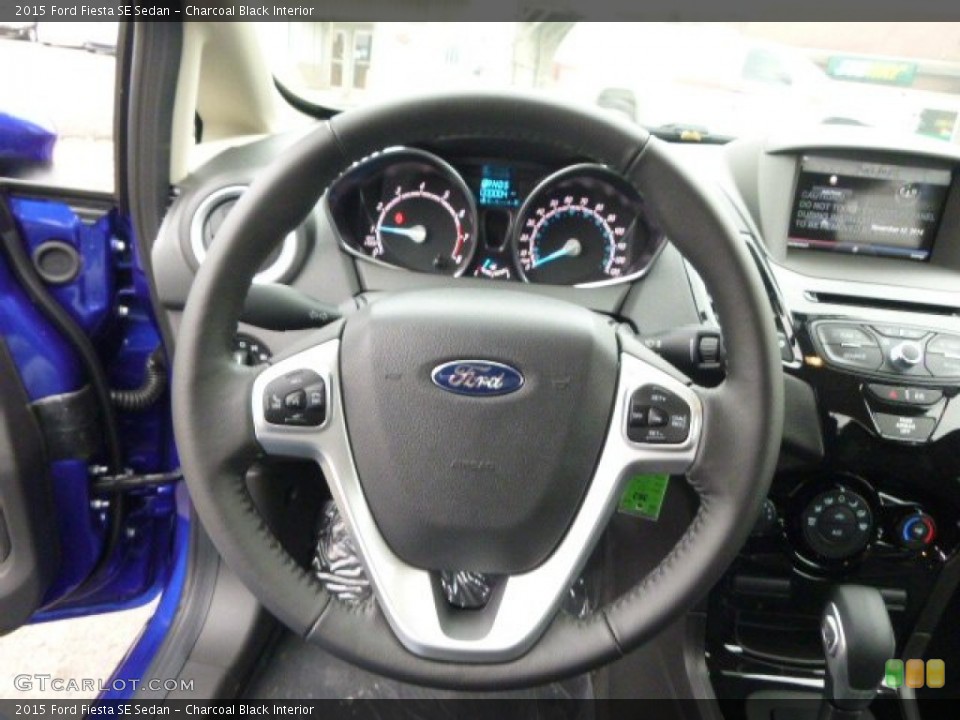 Charcoal Black Interior Steering Wheel for the 2015 Ford Fiesta SE Sedan #99145801