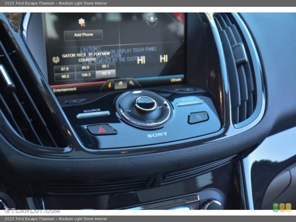 Medium Light Stone Interior Controls for the 2015 Ford Escape Titanium #99500797