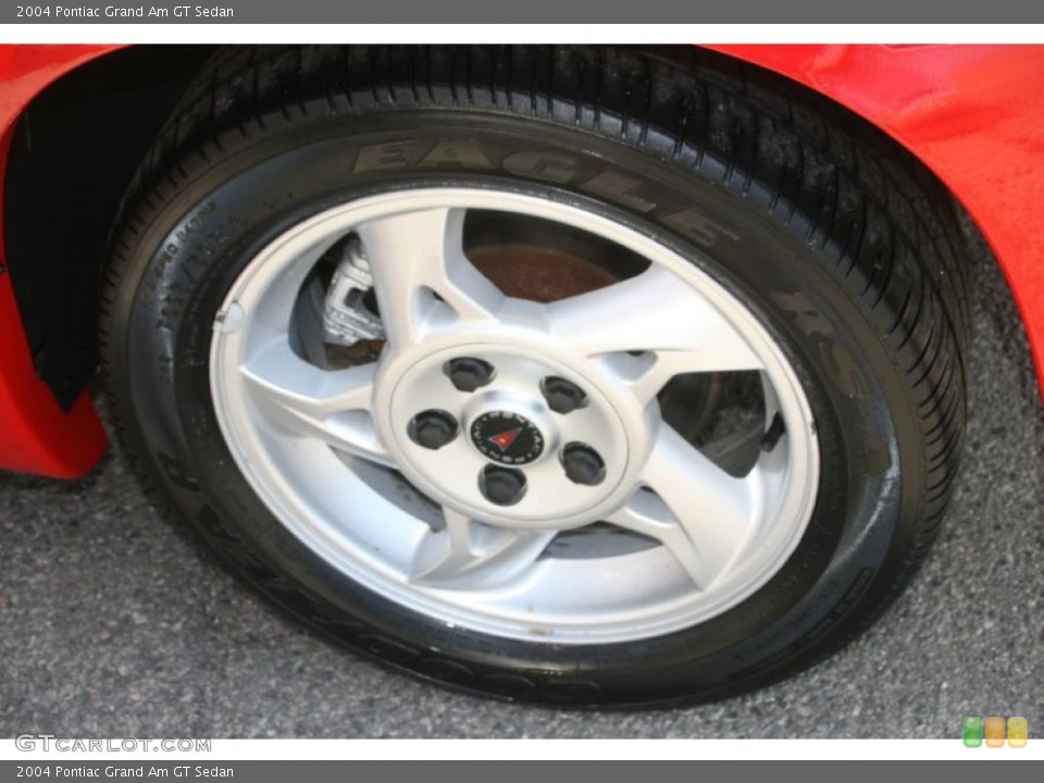 2004 Pontiac Grand Am GT Sedan Wheel and Tire Photo #38907586
