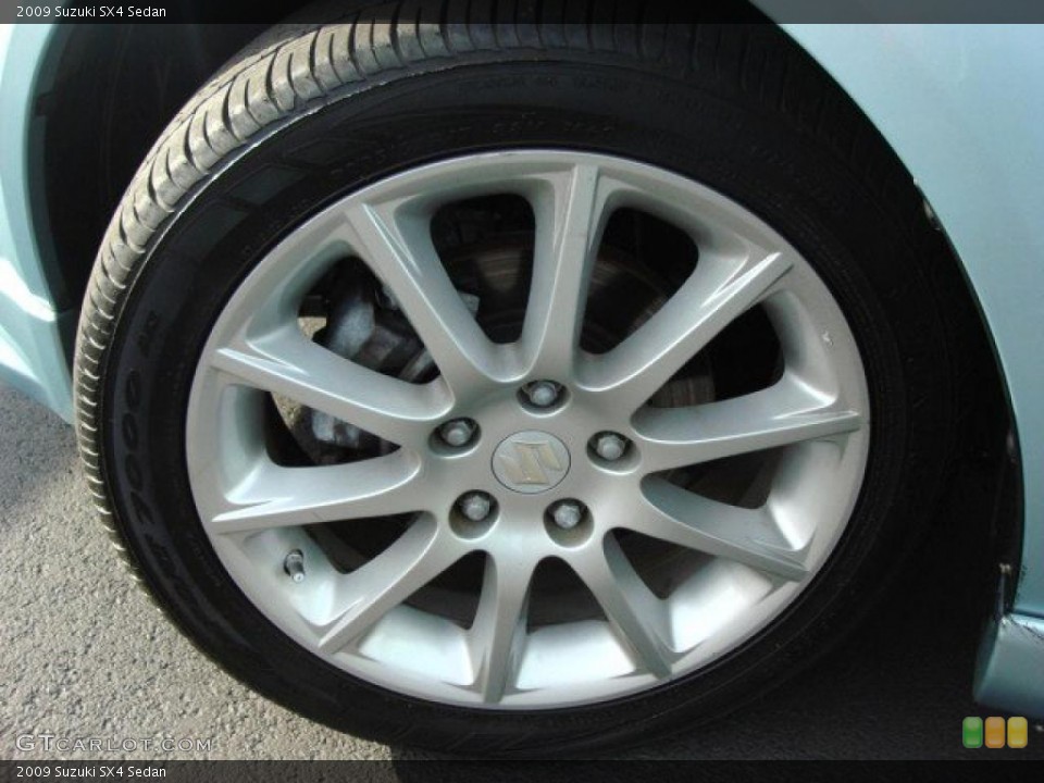 2009 Suzuki SX4 Sedan Wheel and Tire Photo #48447756