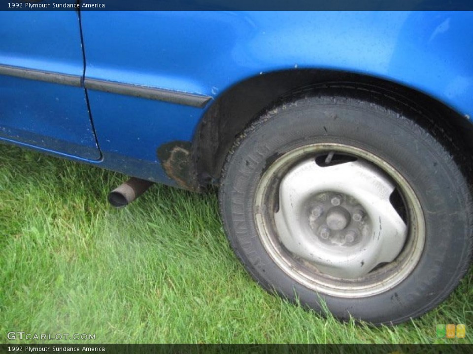 1992 Plymouth Sundance America Wheel and Tire Photo #49453645