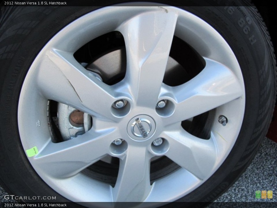 2012 Nissan Versa 1.8 SL Hatchback Wheel and Tire Photo #62483323