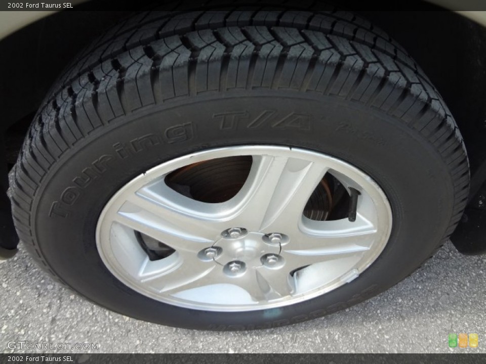 2002 Ford Taurus SEL Wheel and Tire Photo #67423152