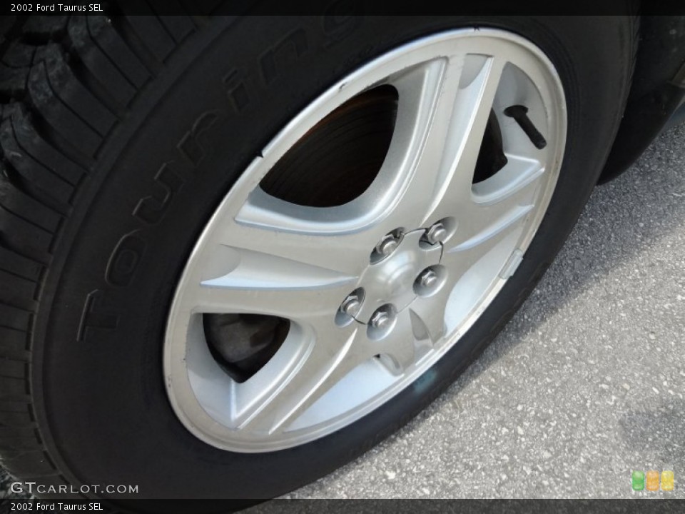 2002 Ford Taurus SEL Wheel and Tire Photo #67423161