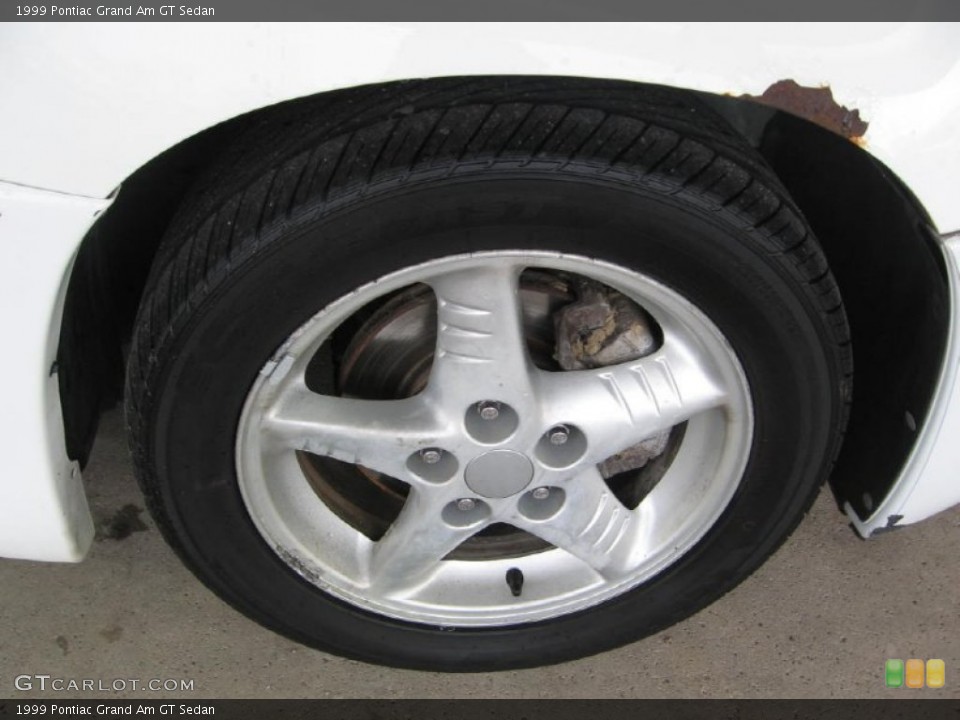 1999 Pontiac Grand Am GT Sedan Wheel and Tire Photo #88200237