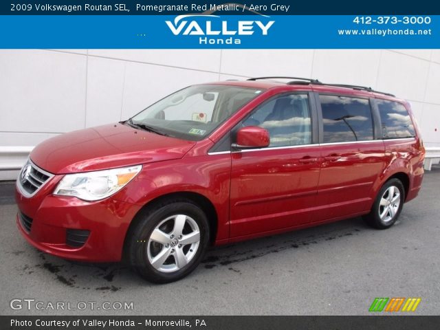 2009 Volkswagen Routan SEL in Pomegranate Red Metallic