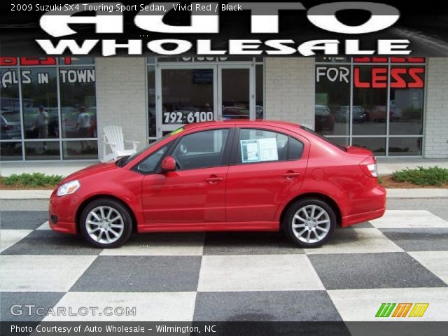 2009 Suzuki SX4 Touring Sport Sedan in Vivid Red