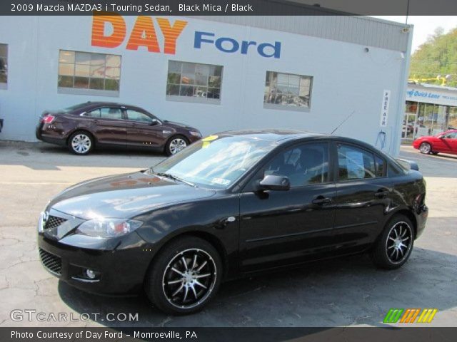 2009 Mazda MAZDA3 i Touring Sedan in Black Mica