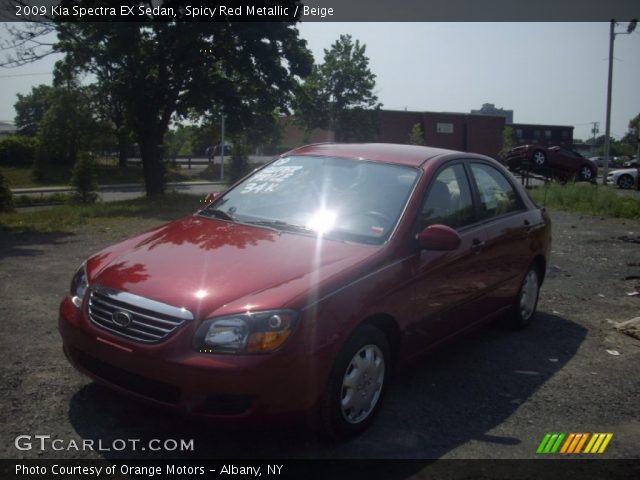 2009 Kia Spectra EX Sedan in Spicy Red Metallic