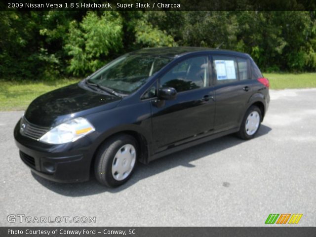 2009 Black nissan versa hatchback #7