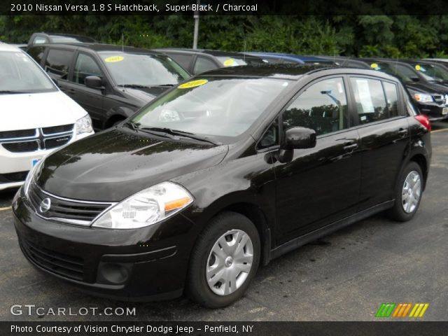 2010 Silver nissan versa hatchback #7