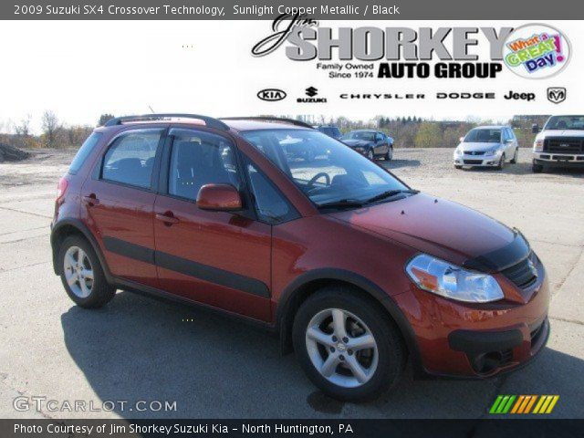 2009 Suzuki SX4 Crossover Technology in Sunlight Copper Metallic