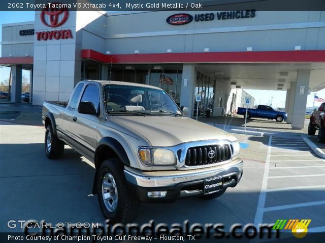2002 Toyota Tacoma V6 Xtracab 4x4 in Mystic Gold Metallic