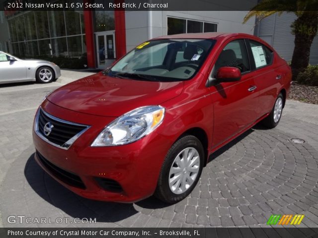 Red nissan versa sedan