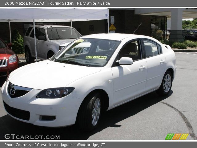 2008 Mazda MAZDA3 i Touring Sedan in Rally White