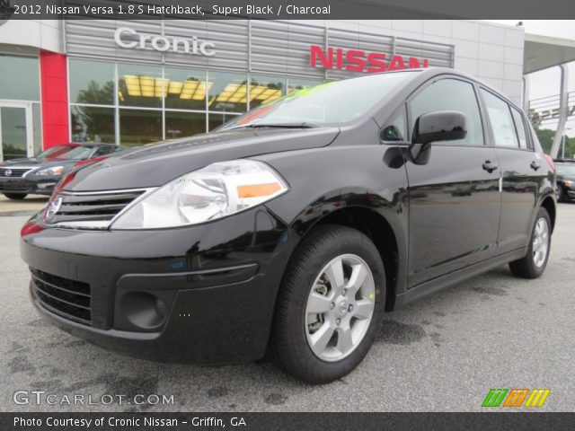 2012 Black nissan versa hatchback #9