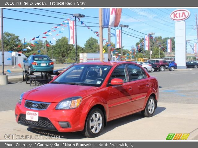 2010 Kia Rio LX Sedan in Tropical Red