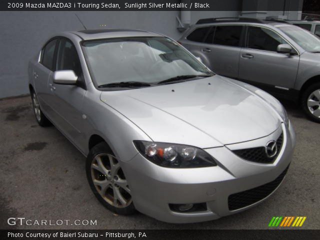2009 Mazda MAZDA3 i Touring Sedan in Sunlight Silver Metallic