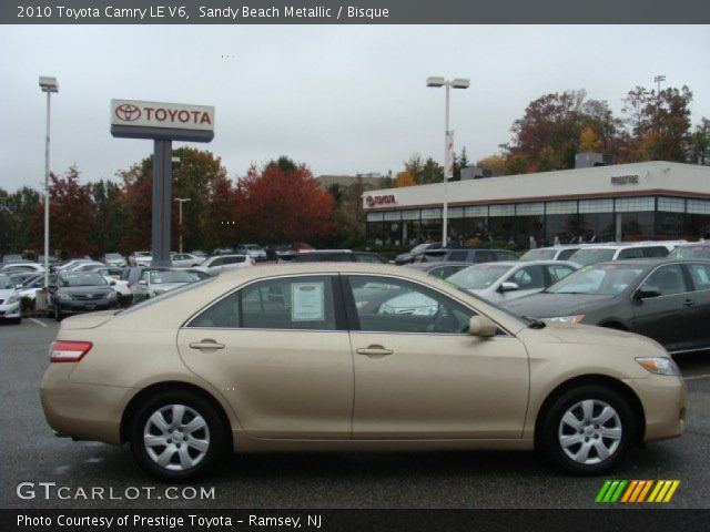 2010 Toyota Camry LE V6 in Sandy Beach Metallic