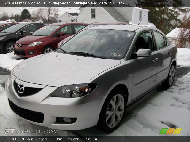 2009 Mazda MAZDA3 i Touring Sedan in Sunlight Silver Metallic
