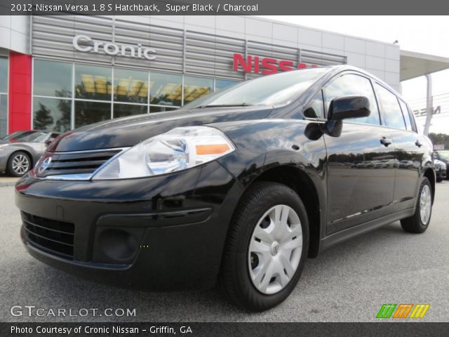 2012 Black nissan versa hatchback #6