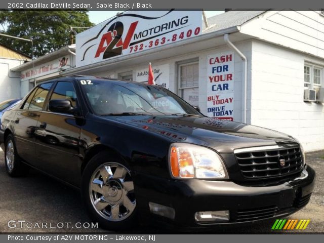 2002 Cadillac DeVille Sedan in Sable Black