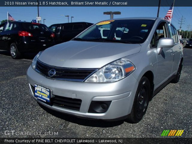2010 Silver nissan versa hatchback #5