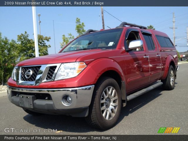 2009 Nissan Frontier LE Crew Cab 4x4 in Red Brick