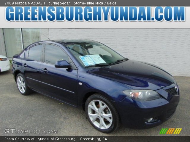 2009 Mazda MAZDA3 i Touring Sedan in Stormy Blue Mica