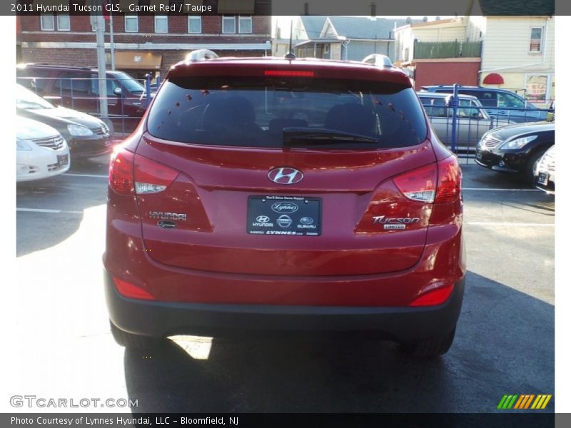Garnet Red / Taupe 2011 Hyundai Tucson GLS