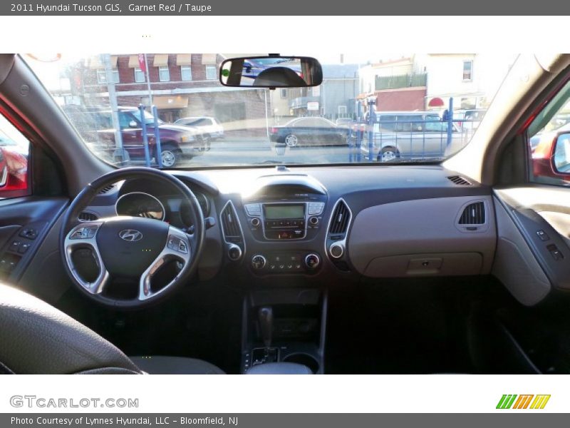 Garnet Red / Taupe 2011 Hyundai Tucson GLS