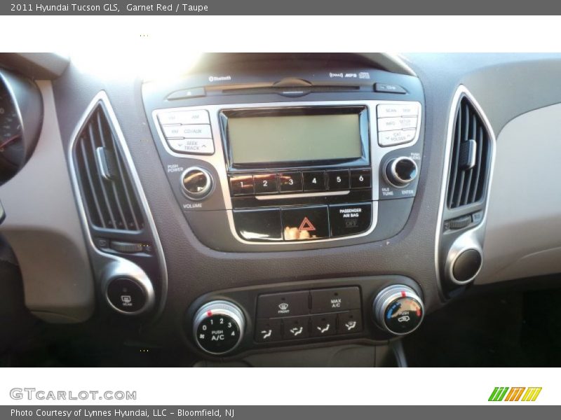 Garnet Red / Taupe 2011 Hyundai Tucson GLS