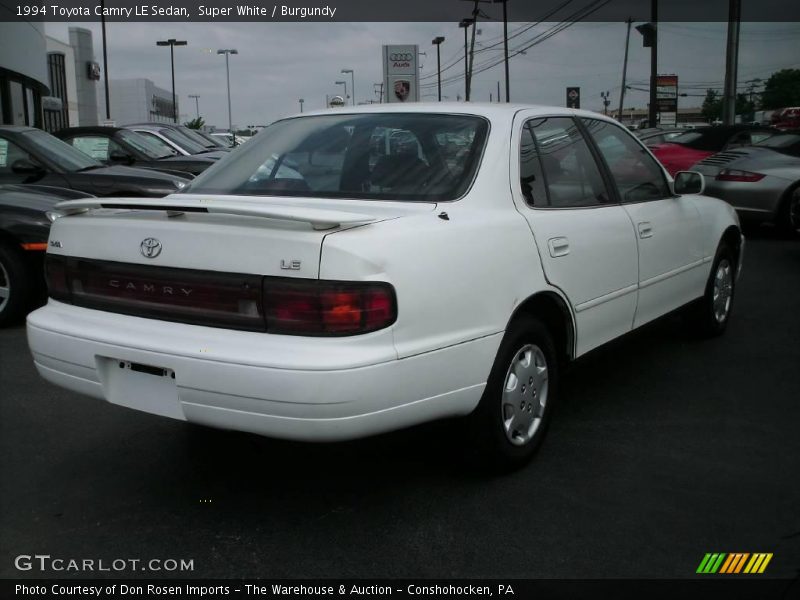 Super White / Burgundy 1994 Toyota Camry LE Sedan